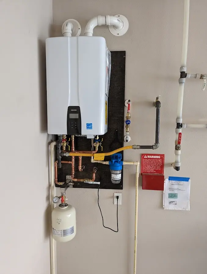 Professional plumber installing copper piping in a South Monrovia Island home